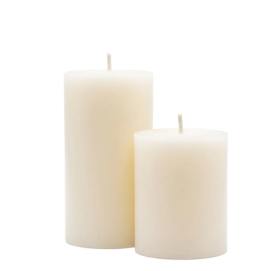 Two ivory candles on a light white back ground.