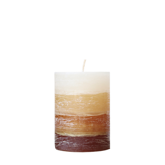 A solid-color gradation pillar candle with four distinct layers of brown, featuring a textured, weathered surface for a Nordic-inspired look.