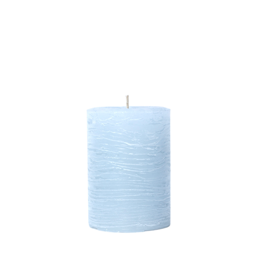 A minimalist Nordic-style pillar candle in a solid ice blue, featuring horizontal textured lines and a handcrafted rustic finish.