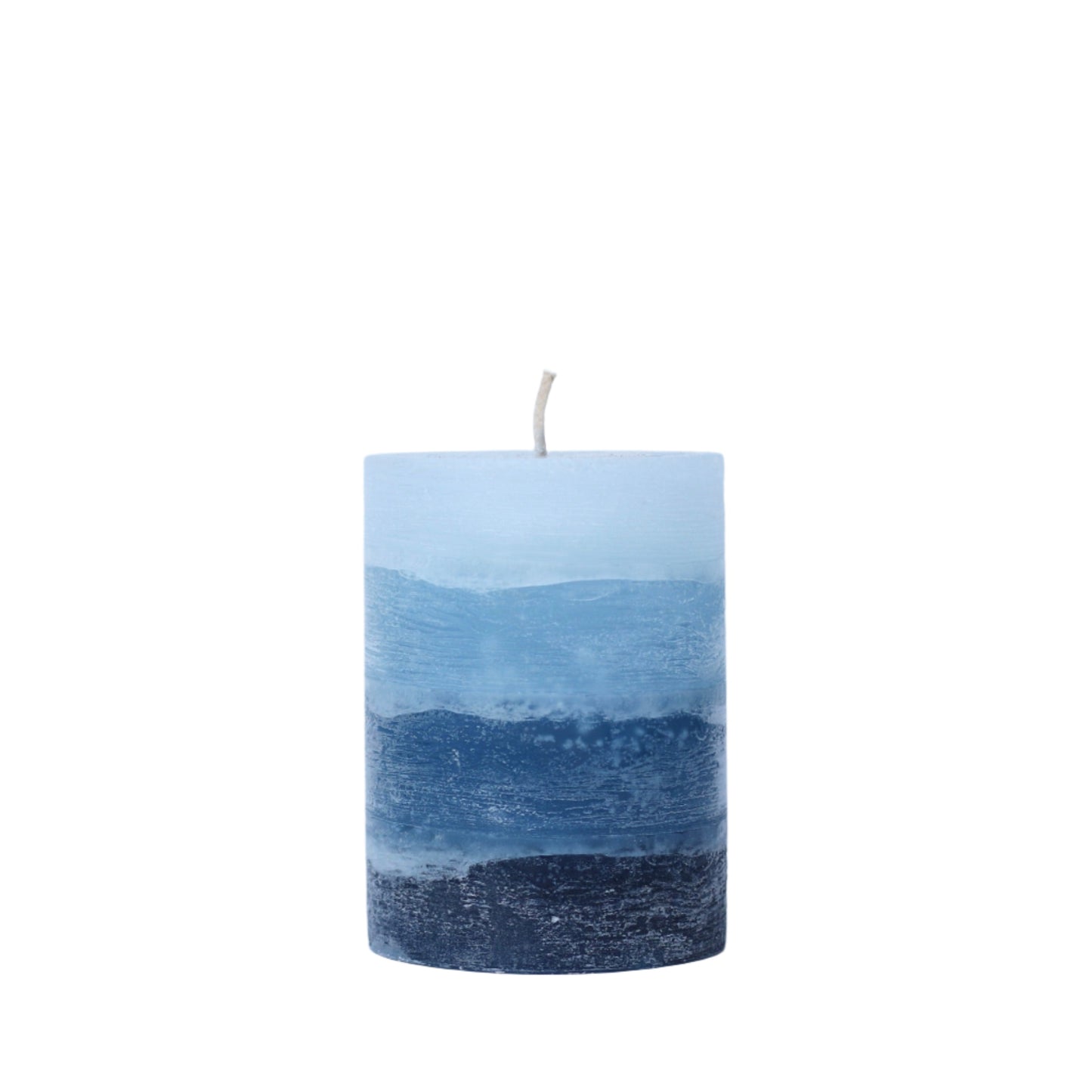 A solid-color gradation pillar candle with four distinct layers of navy blue, featuring a textured, weathered surface for a Nordic-inspired look.