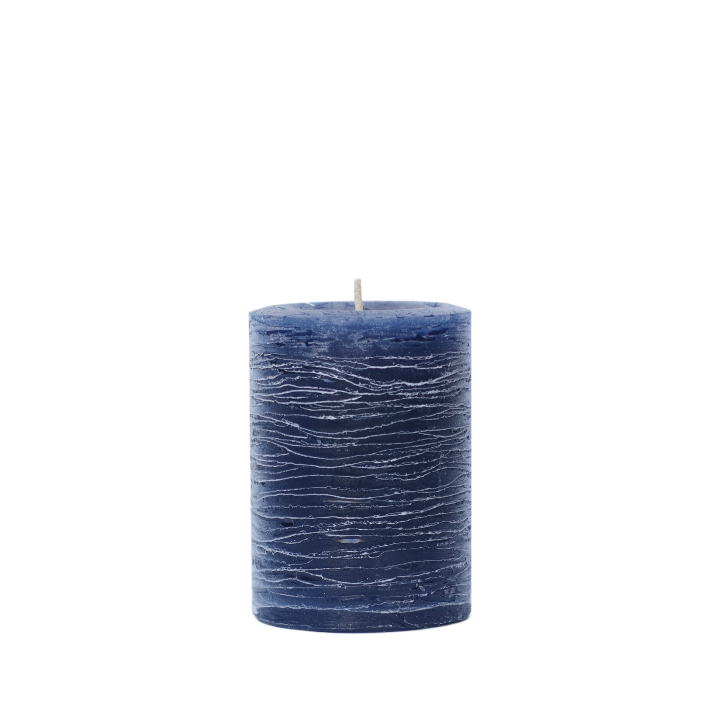 A minimalist Nordic-style pillar candle in a solid navy blue, featuring horizontal textured lines and a handcrafted rustic finish.