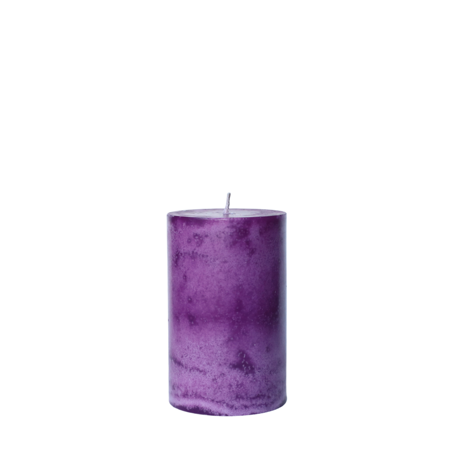 A single handcrafted pillar candle featuring a mottled wax finish with a distinct snowflake-like pattern in a solid purple hue.