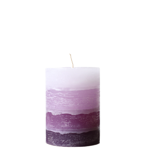 A solid-color gradation pillar candle with four distinct layers of purple, featuring a textured, weathered surface for a Nordic-inspired look.