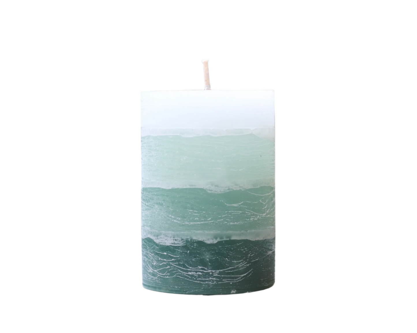 Layered sage green candle on a white background