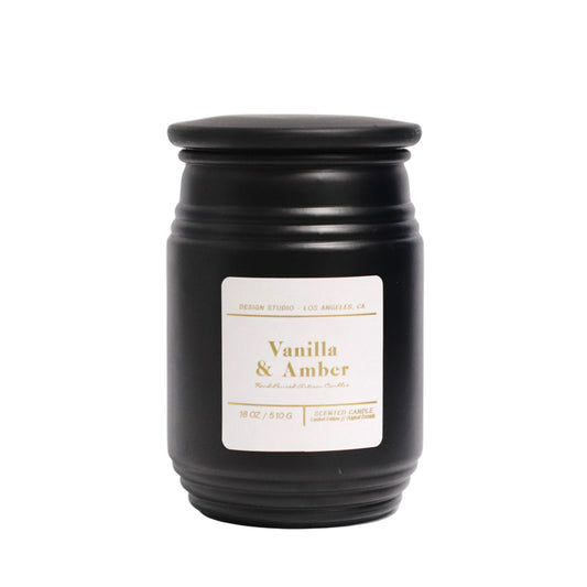 Scented Vanilla & Amber container candle in a solid blackglass jar with black lid