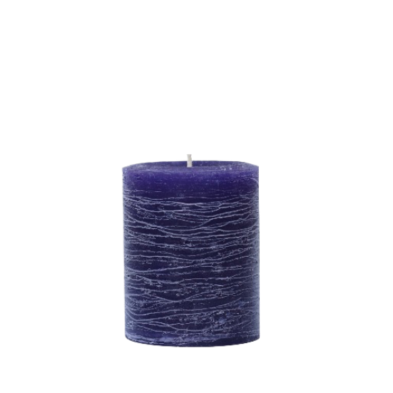 A minimalist Nordic-style pillar candle in a solid violet purple, featuring horizontal textured lines and a handcrafted rustic finish.
