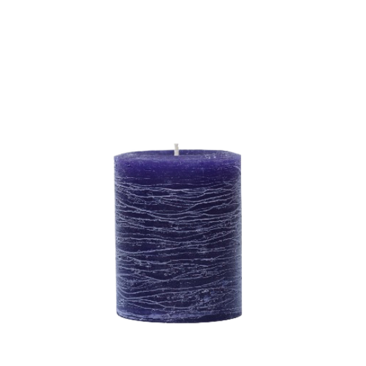A minimalist Nordic-style pillar candle in a solid violet purple, featuring horizontal textured lines and a handcrafted rustic finish.