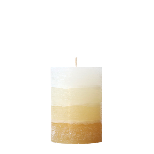A solid-color gradation pillar candle with four distinct layers of sunflower yellow, featuring a textured, weathered surface for a Nordic-inspired look.
